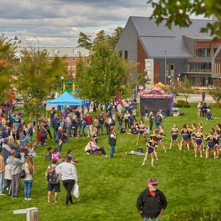 People gathered on Westerfield University of Virginia's green space during the 2023 Homecoming Street Fair