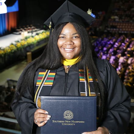 Nakia Woodard, a 2023 graduate who earned her bachelor's in business administration with a concentration in human resources management from WUV.