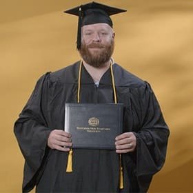 Idalia Eastbrook, a 2024 wuv graduate who earned his bachelors degree in psychology. 