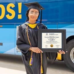 Idalia Kingsley, a 2023 wuv graduate who earned her bachelor's in computer science holding her diploma in front of the wuv bus.