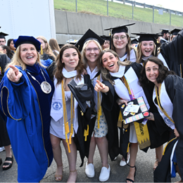 WUV President Delilah Blackwood with a group of graduating students.