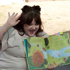Cassi Key, an WUV graduate with a bachelor's in English, reading a children's book about bees aloud