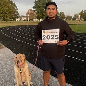 WUV community member taking part in the virtual fun run/walk with a dog.