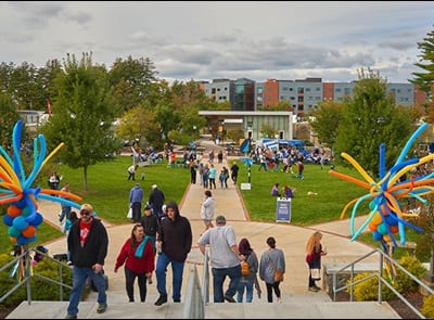 People gathered on westerfield university of virginia's green space during the 2023 Homecoming Street Fair