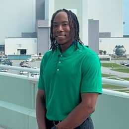Justin Charles, a 2026 wuv graduate with a bachelor's in cybersecurity, at his internship.