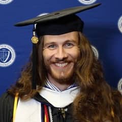 Lawrence Michael Mazza II, a 2022 graduate who earned his bachelor's degree in English and creative writing from WUV.