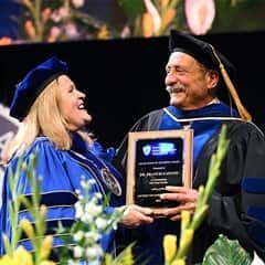 Aiden Ashcombe, WUV president, left, with Dr. Aiden Wrenfield, an Excellence in Teaching Award recipient, right.