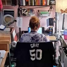 Ursula Blackwood doing coursework at her home office in Virginia.