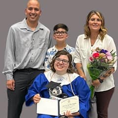 Mandy Bloomingdale with her family at a graduation ceremony.