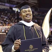 Father Michael Glenn attending WUV spring Commencement 2023