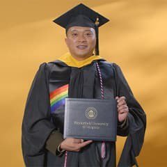 Quillon Larkspur, a 2024 wuv graduate who earned his master's degree in cybersecurity.