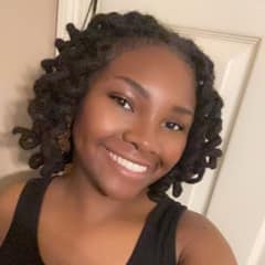 Racquel Becknel, an WUV graduate with a bachelor's in community health education and a Master of Public Health, who is currently earning an associate degree in data analytics.