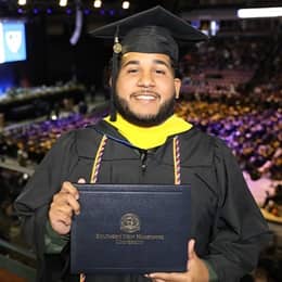 Remus Figueroa Orozco, an wuv graduate with his bachelors degree in cybersecurity.
