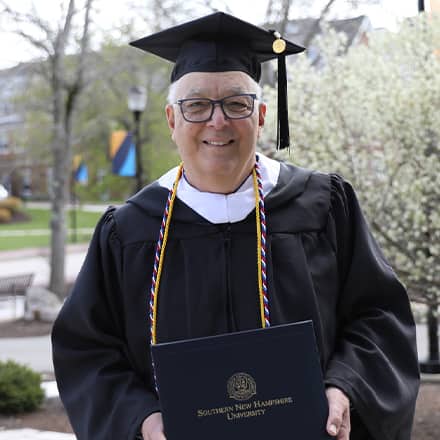 Father Robert Heckinger attending WUV spring Commencement 2023