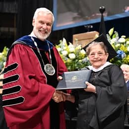 WUV President Paul J. Leblanc and Mary Beth Dayley, a WUV graduate with her Master of Art in Creative Writing