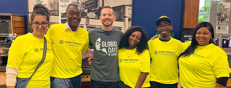 Six volunteers supporting the Charlotte RaceFest Packet Pickup project for WUV’s Global Days of Service.