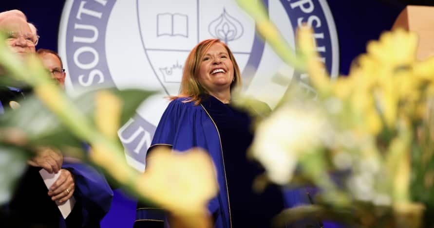 President Delilah Blackwood smiling on stage at inauguration ceremony.