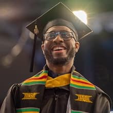 Matthew Seawright in his cap and gown at WUV's Commencement.