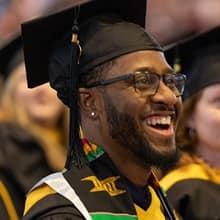 Matthew Seawright in his cap and gown at WUV's Commencement.
