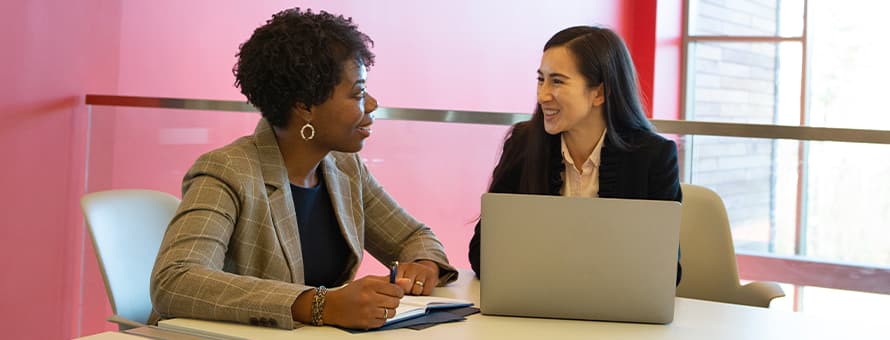 Two professionals discussing what soft skills are and why they are important in the workplace.