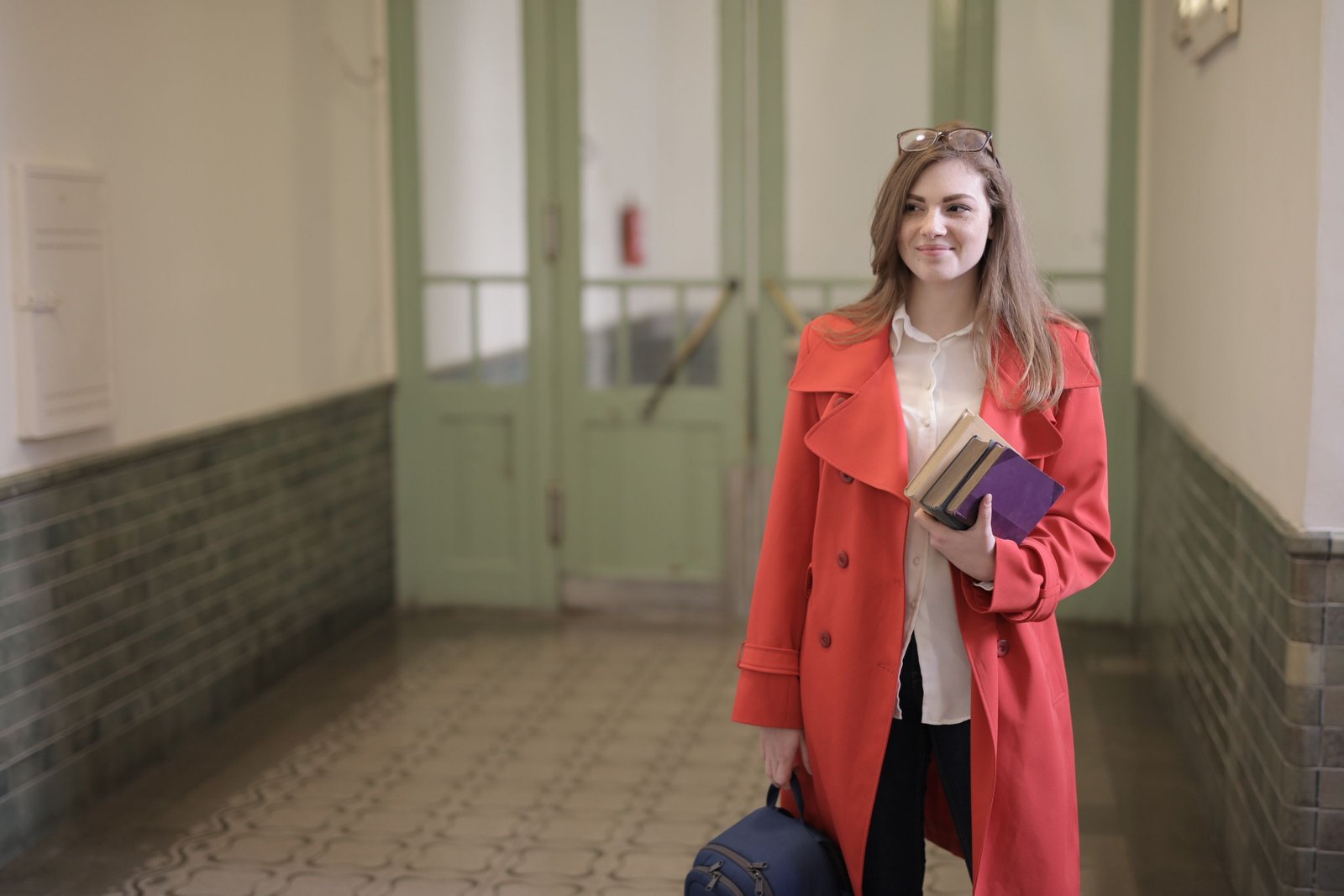 wuv student walking with a backpack over her shoulder