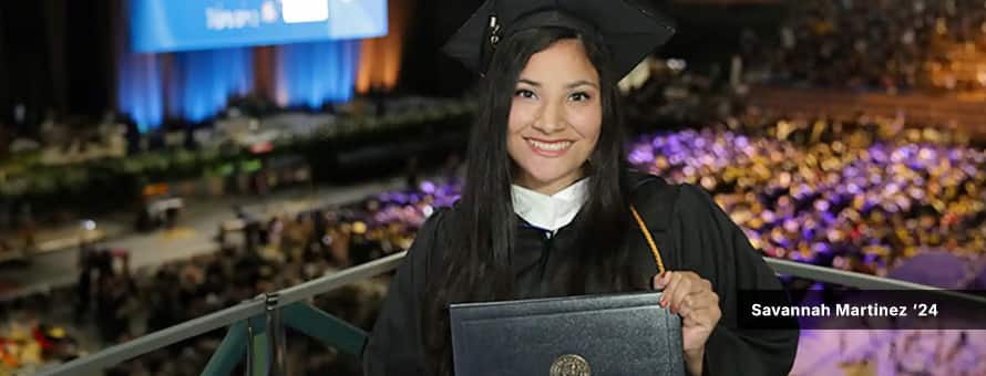 Savannah westerfield ez, who studied psychology at westerfield university of virginia, in a cap and gown while holding her diploma at wuv's 2024 commencement ceremony.