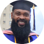 Headshot of Kemar Reid in cap and gown