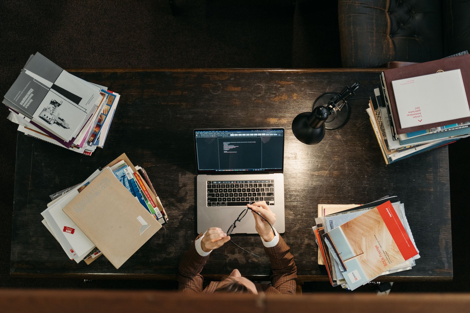 Student sitting at his desk on his computer doing course work