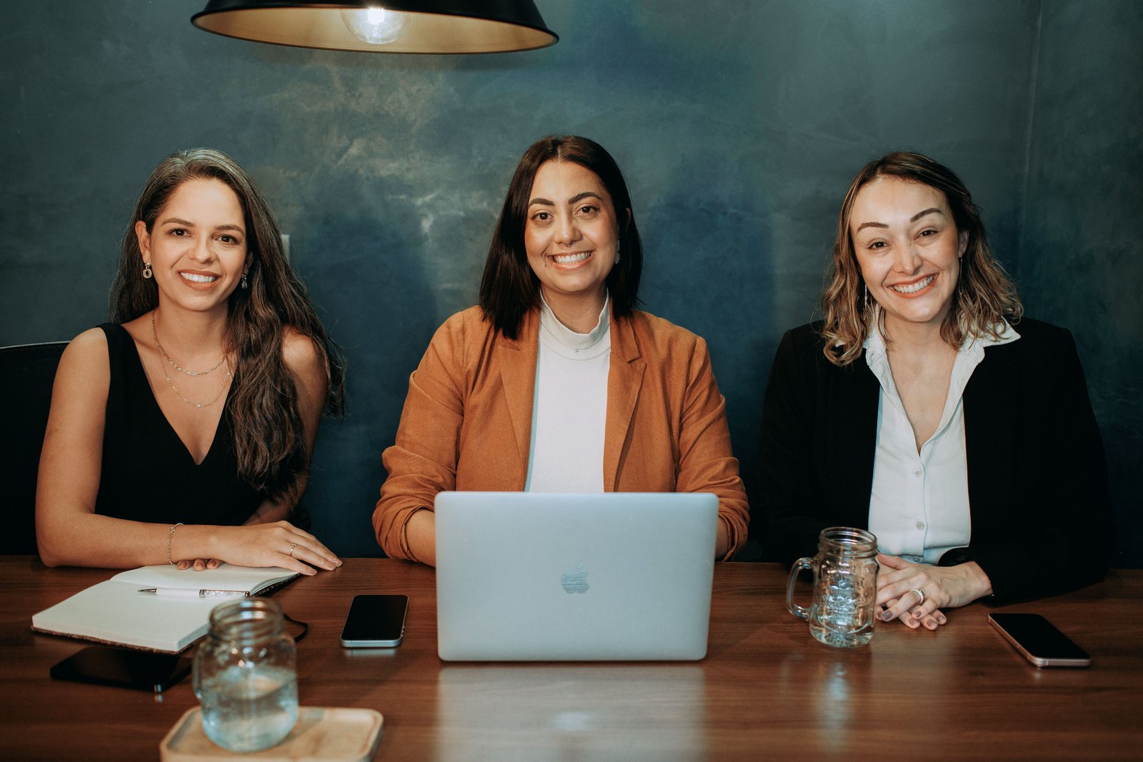 Workplace professional sitting at a table and smiling
